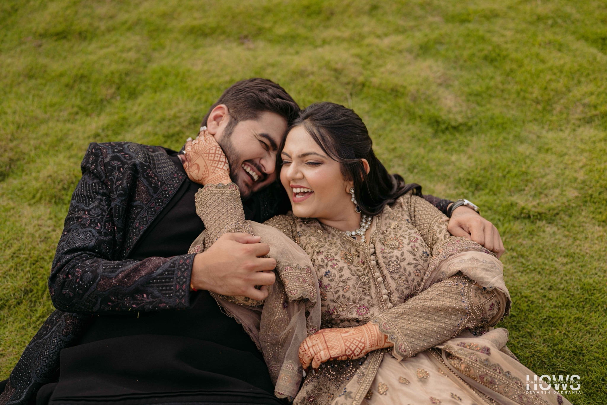 A couple share a tender moment, photographed by House Of The Wedding Stories